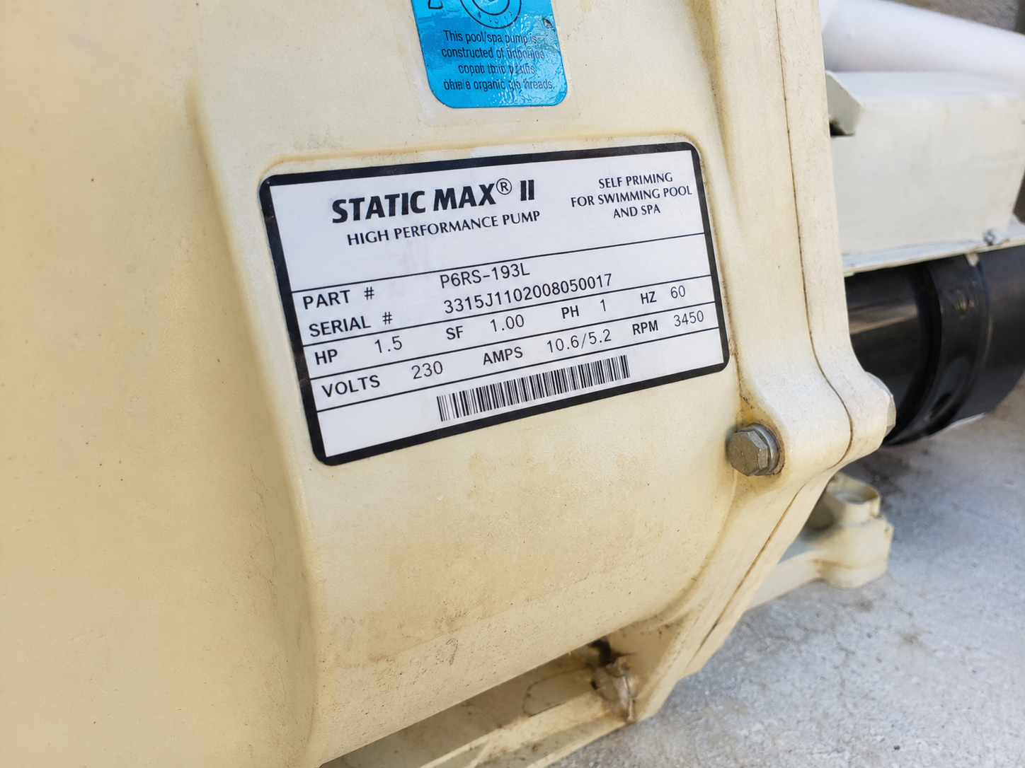 Close-up of a pool pump nameplate label showing model, serial number, and specs — example of how to photograph your equipment